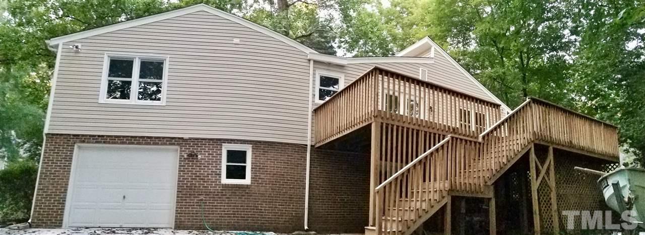 6420 Rockrest Court Raleigh, NC 27612 - Photo 20 of 22 Rear exterior of the home...check out that huge deck!
