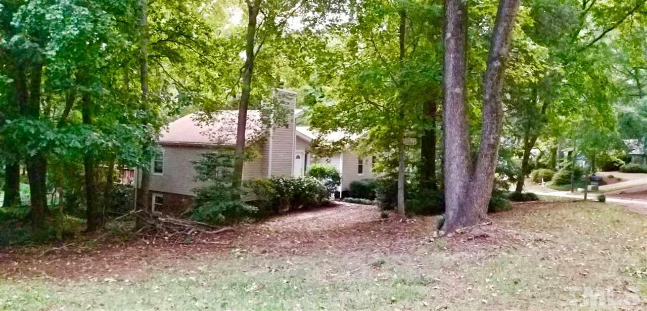 6420 Rockrest Court Raleigh, NC 27612 - Photo 21 of 22 View of the home from the corner...spacious lot w/ mature hardwood trees