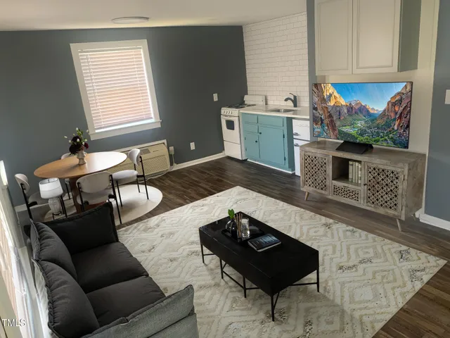 a living room with furniture and a table