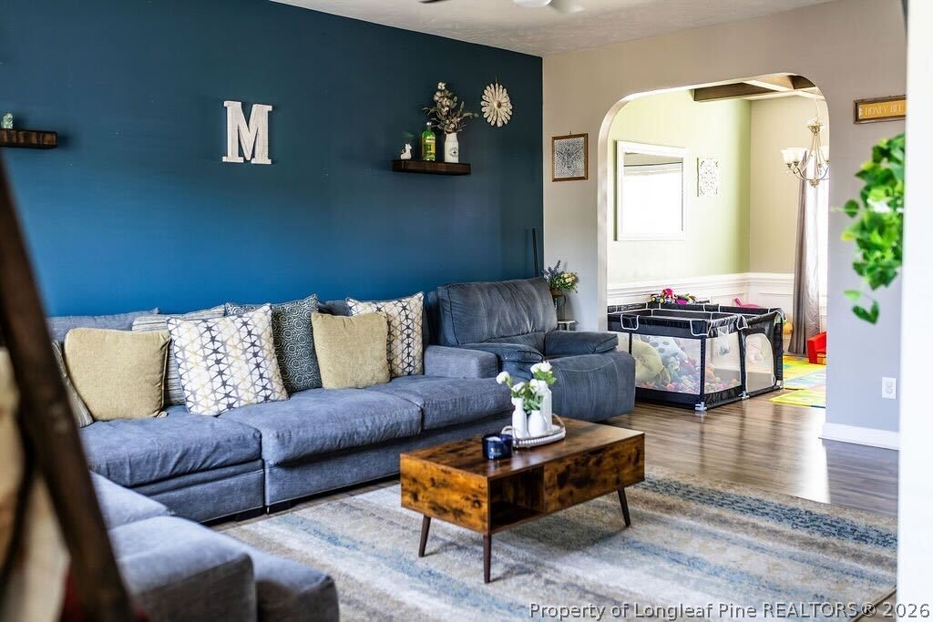 210 McGougan Road Lumber Bridge, NC 28357 - Photo 19 of 47 a living room with furniture and wooden floor