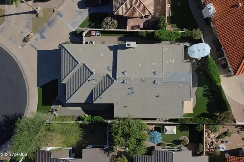 an aerial view of multiple houses with yard