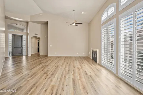 wooden floor in an empty room with a window