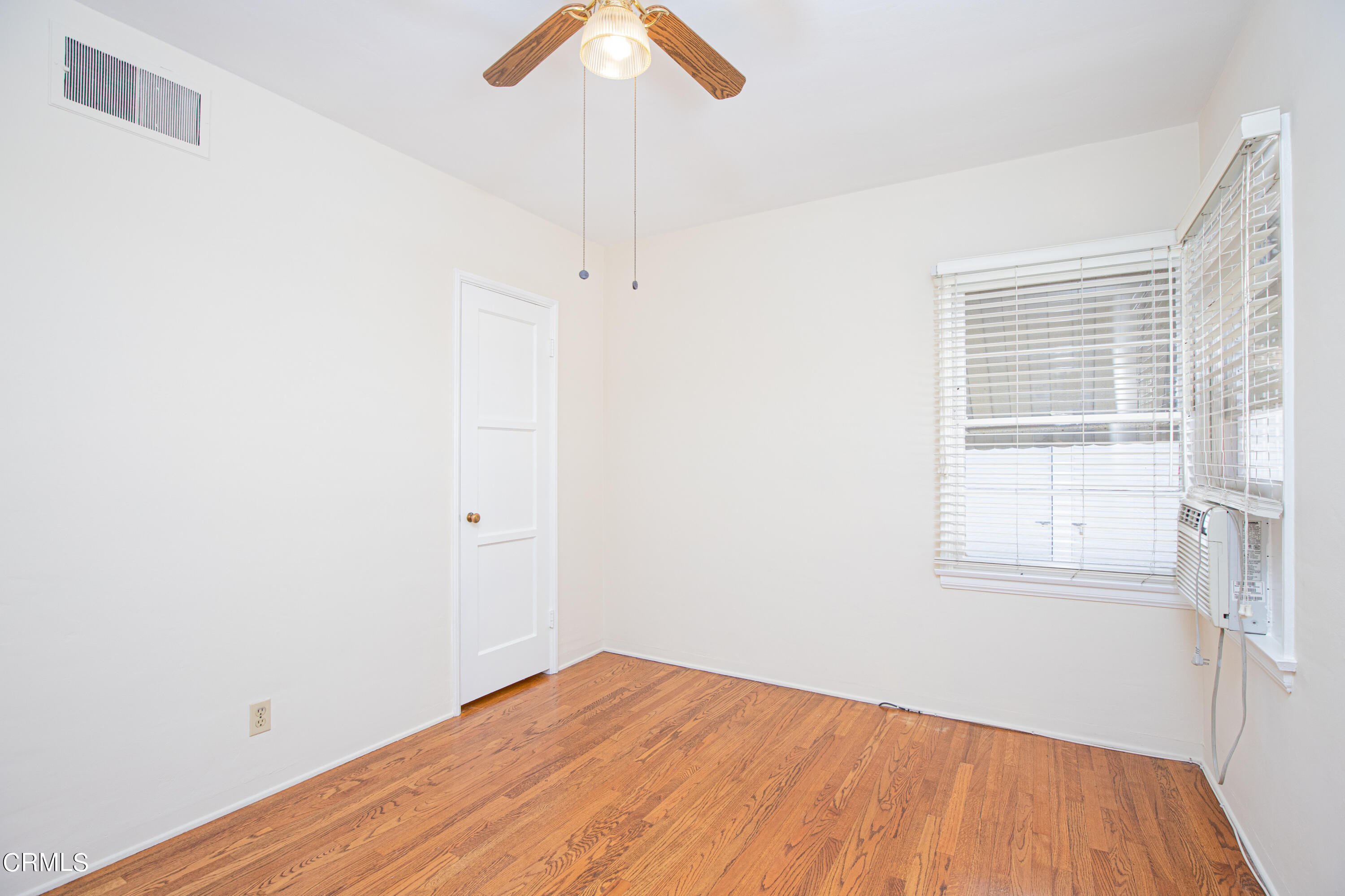 1564 Riverside Drive Glendale, CA 91201 - Photo 15 of 24 an empty room with a window and wooden floor