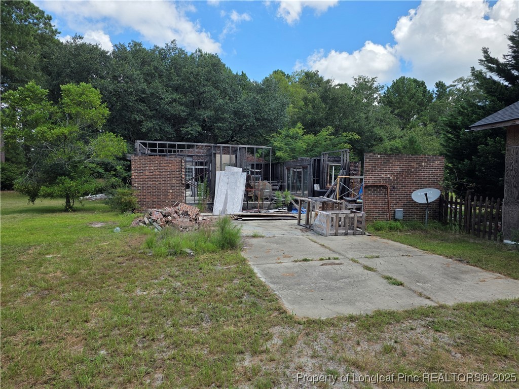 6405 Cedar Creek Road Fayetteville, NC 28312 - Photo 3 of 6 an outdoor space with patio and garden