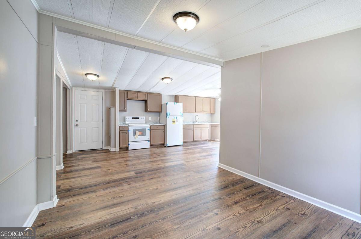 50 Tency Lane Northeast Rome, GA 30165 - Photo 23 of 23 a view of a kitchen with wooden floor and a window