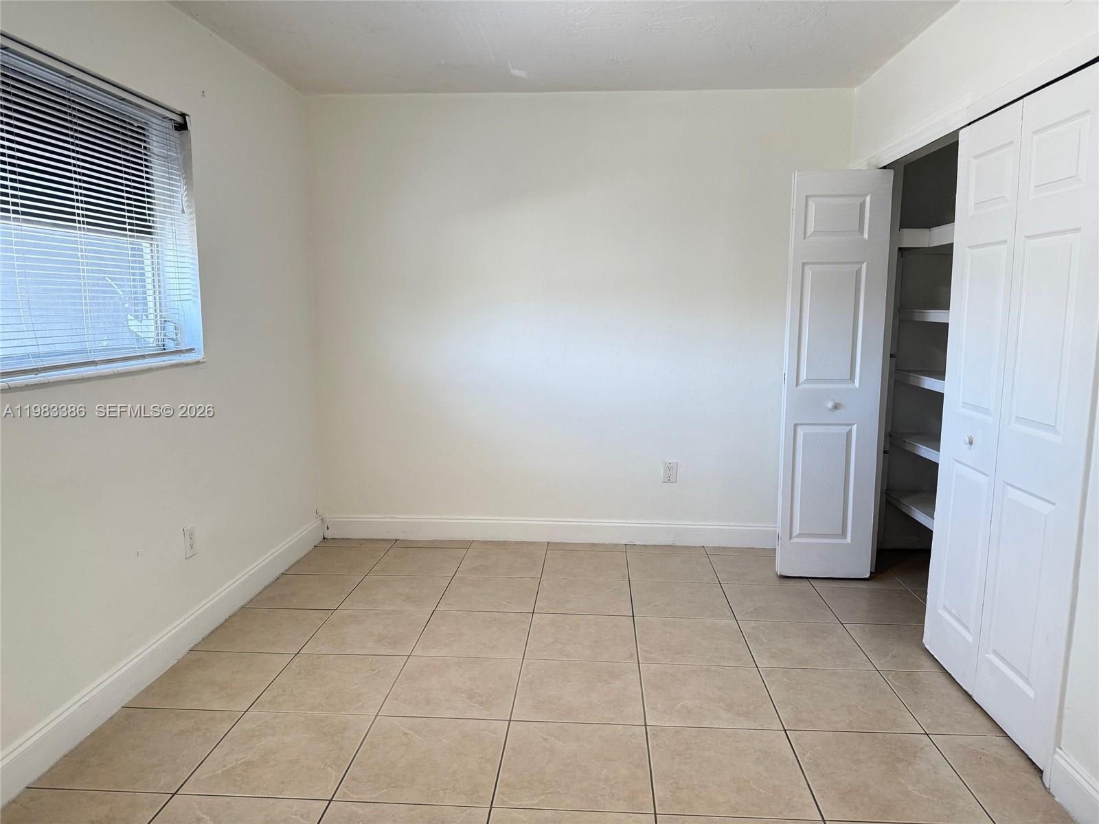 4300 Southwest 67th Avenue, Unit 38 Miami, FL 33155 - Photo 5 of 8 an empty room with a bathroom