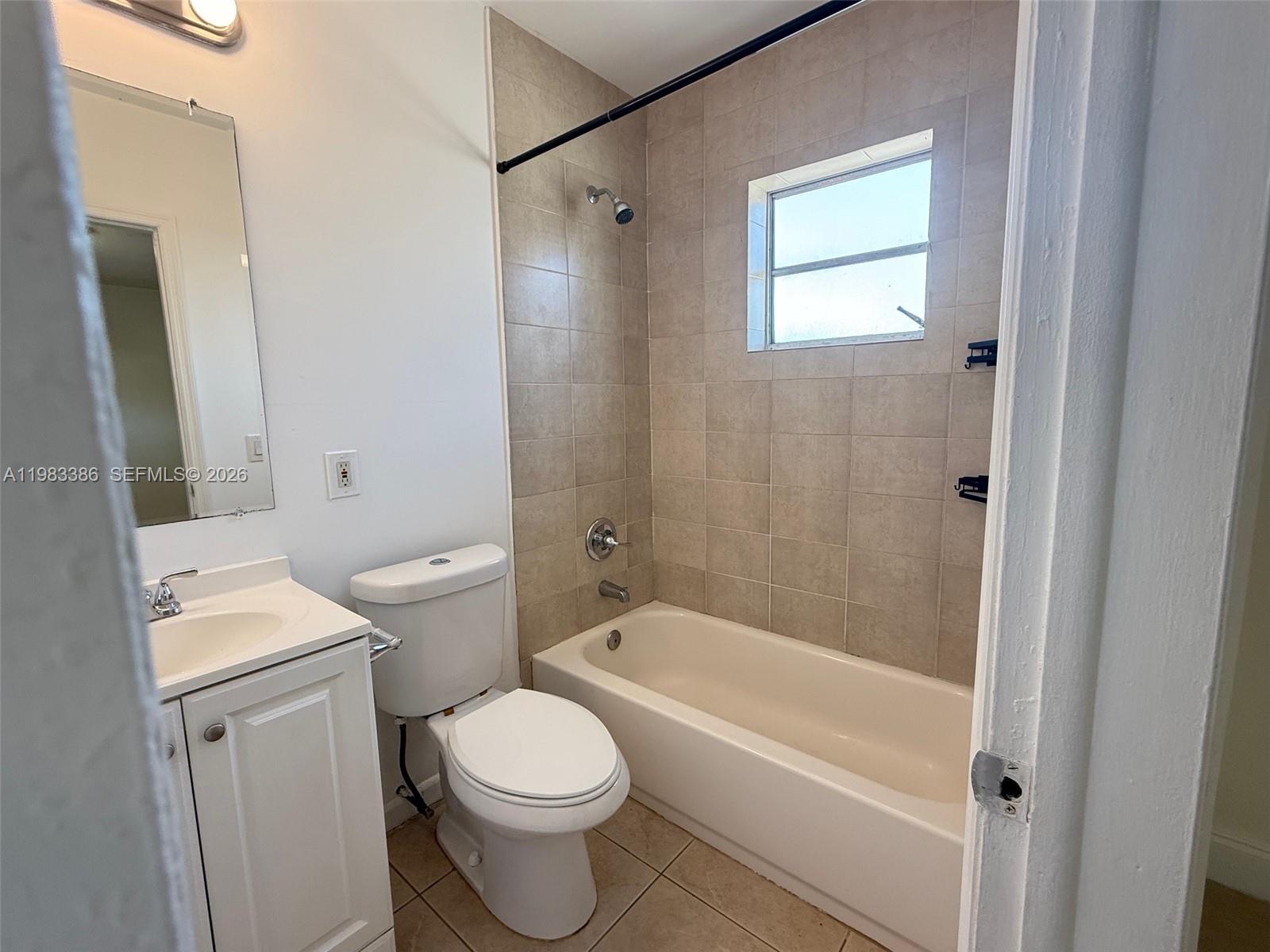 4300 Southwest 67th Avenue, Unit 38 Miami, FL 33155 - Photo 6 of 8 a white toilet sitting next to a bath tub