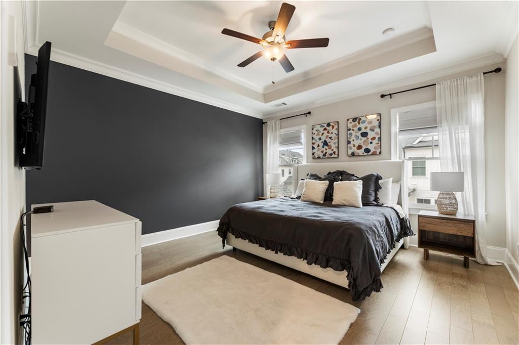 884 Mayfield Road Milton, GA 30004 - Photo 11 of 20 a bedroom with a bed and a ceiling fan