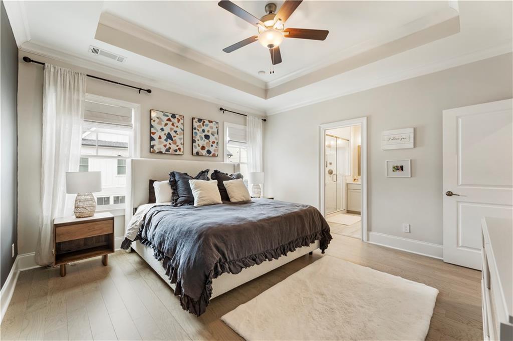 884 Mayfield Road Milton, GA 30004 - Photo 12 of 20 a spacious bedroom with a bed and window