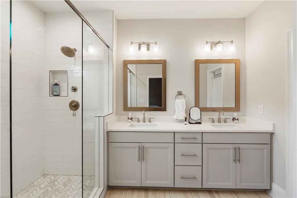 884 Mayfield Road Milton, GA 30004 - Photo 13 of 20 a bathroom with double vanity sinks and a mirror