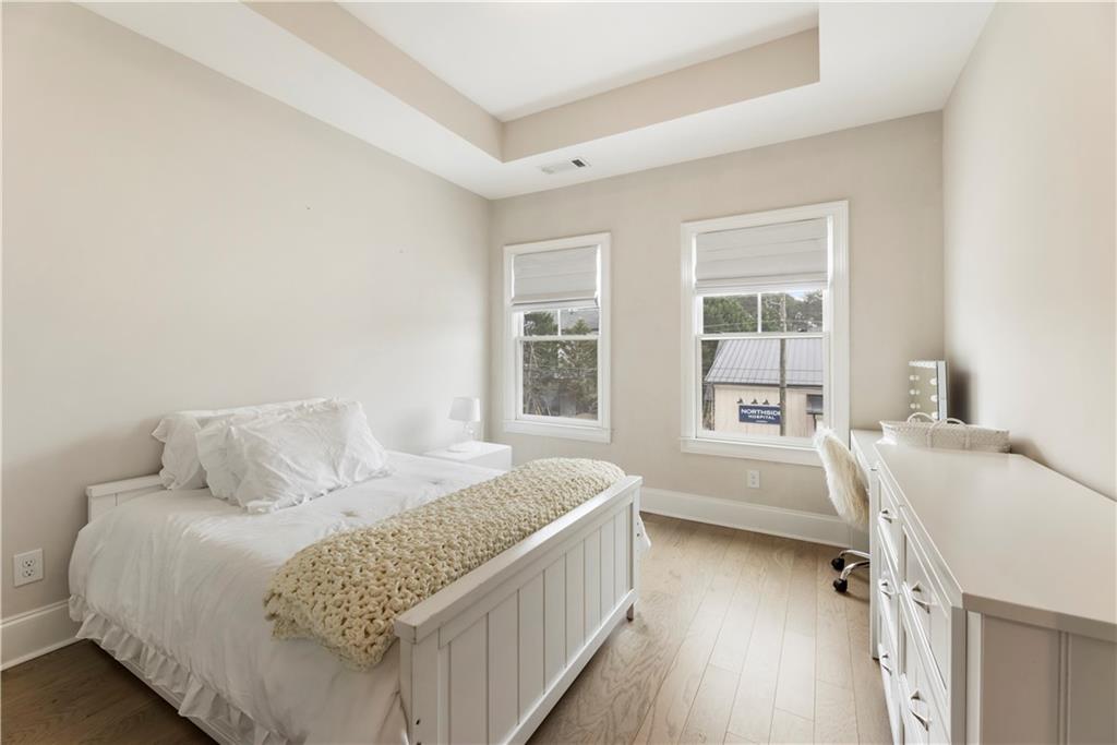 884 Mayfield Road Milton, GA 30004 - Photo 15 of 20 a bedroom with a bed and a window