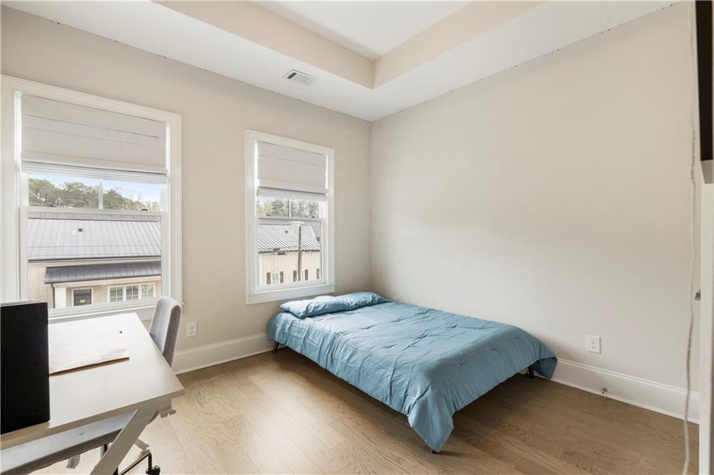 884 Mayfield Road Milton, GA 30004 - Photo 16 of 20 a bedroom with a bed and a window