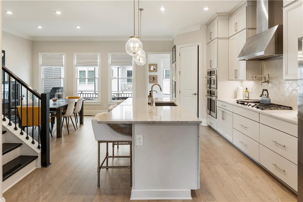 884 Mayfield Road Milton, GA 30004 - Photo 4 of 20 a large kitchen with lots of counter space and stainless steel appliances