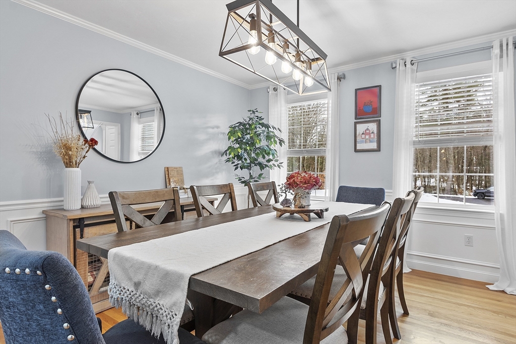 2 Gabes Place Lunenburg, MA 01462 - Photo 21 of 41 a dining room with furniture a chandelier and wooden floor