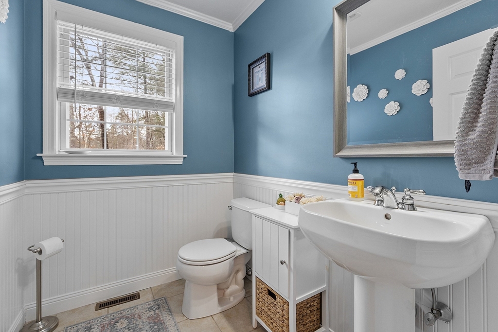 2 Gabes Place Lunenburg, MA 01462 - Photo 25 of 41 a bathroom with a sink mirror and toilet