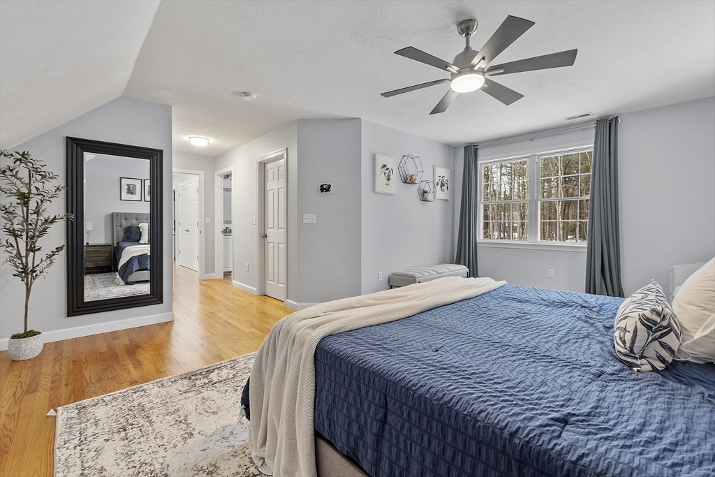 2 Gabes Place Lunenburg, MA 01462 - Photo 27 of 41 a bedroom with a large bed and a chandelier