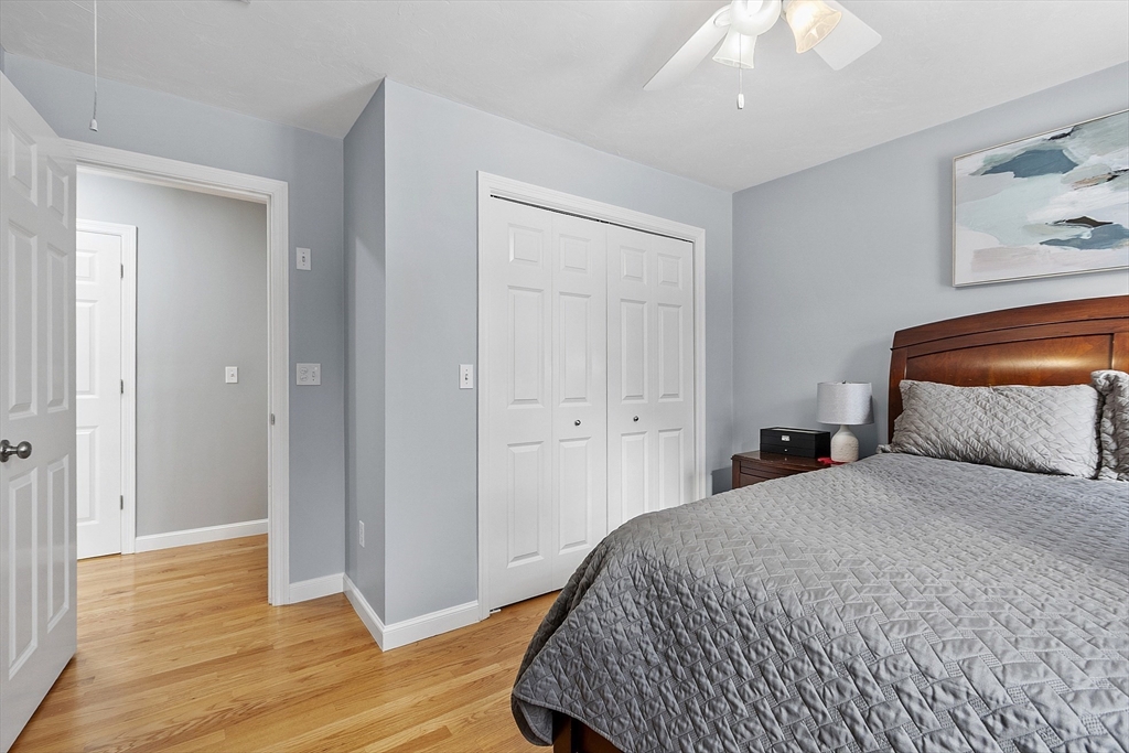 2 Gabes Place Lunenburg, MA 01462 - Photo 29 of 41 a bedroom with a bed and wooden floor