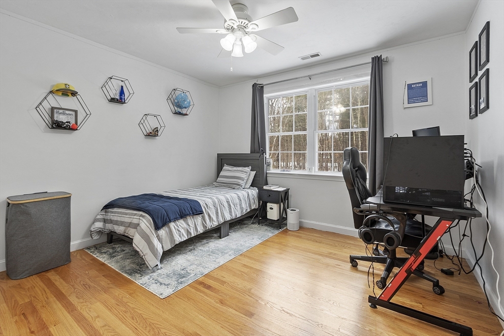 2 Gabes Place Lunenburg, MA 01462 - Photo 33 of 41 a bedroom with a bed and wooden floor