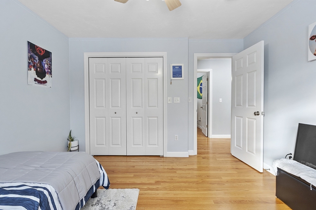 2 Gabes Place Lunenburg, MA 01462 - Photo 38 of 41 a bedroom with a bed and wooden floor