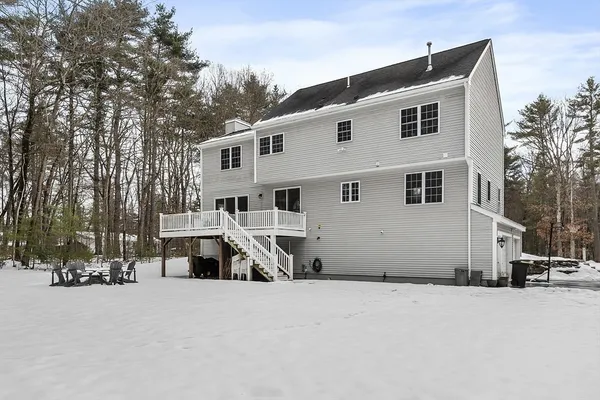 a house that has a tree in front of it