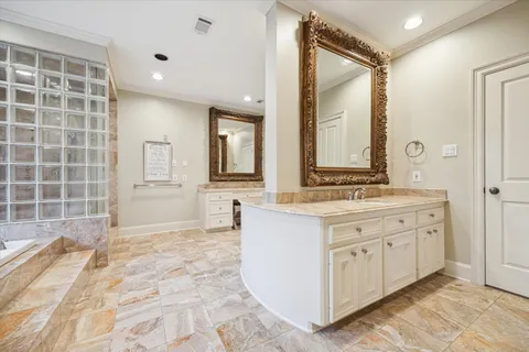 a spacious bathroom with a large tub shower and windows