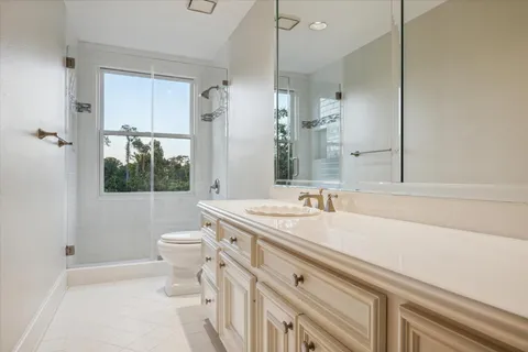 a bedroom with furniture and a flat screen tv