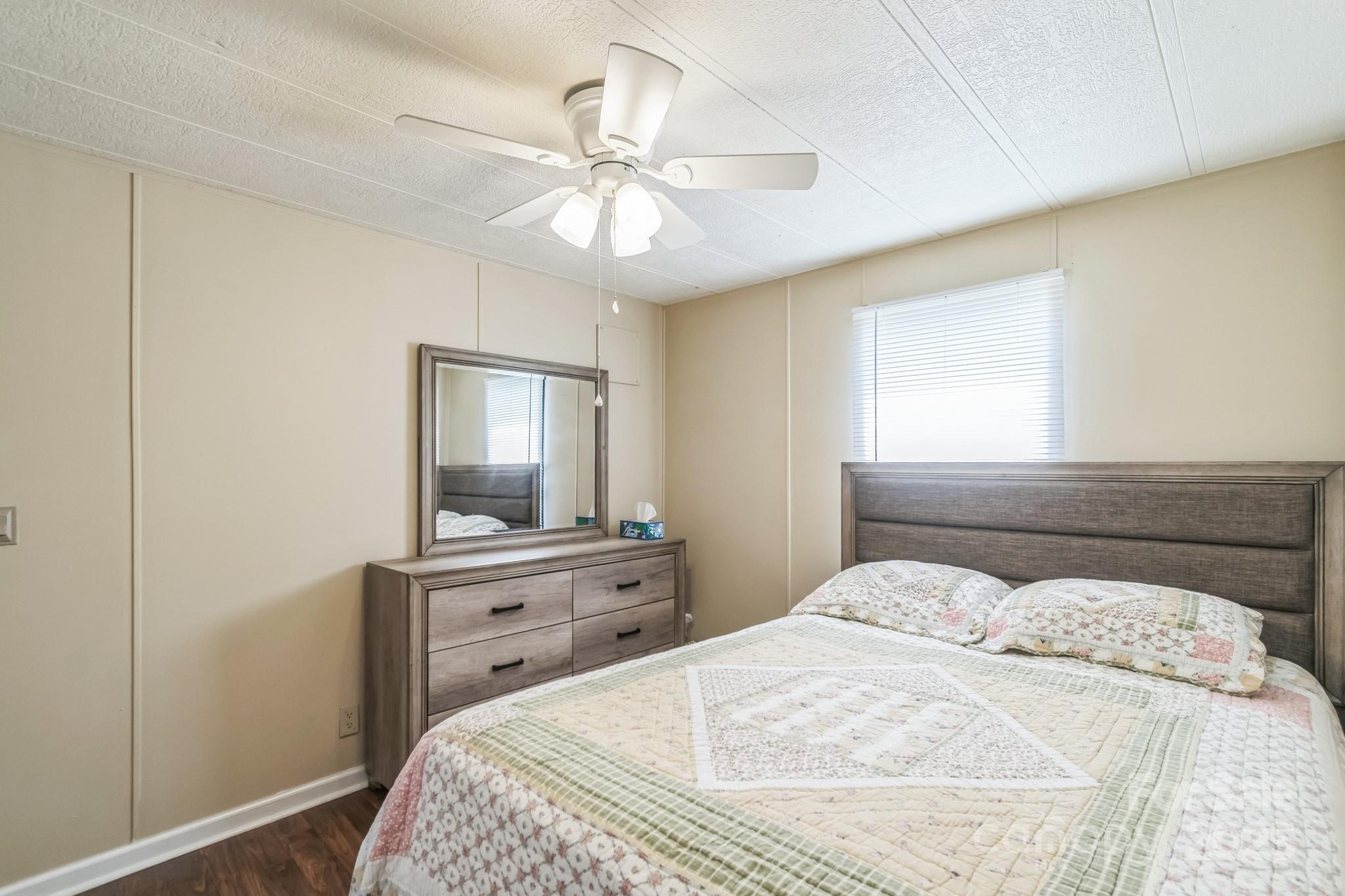 164 Phelps Road Chesterfield, SC 29709 - Photo 11 of 27 a bedroom with a bed and a dresser