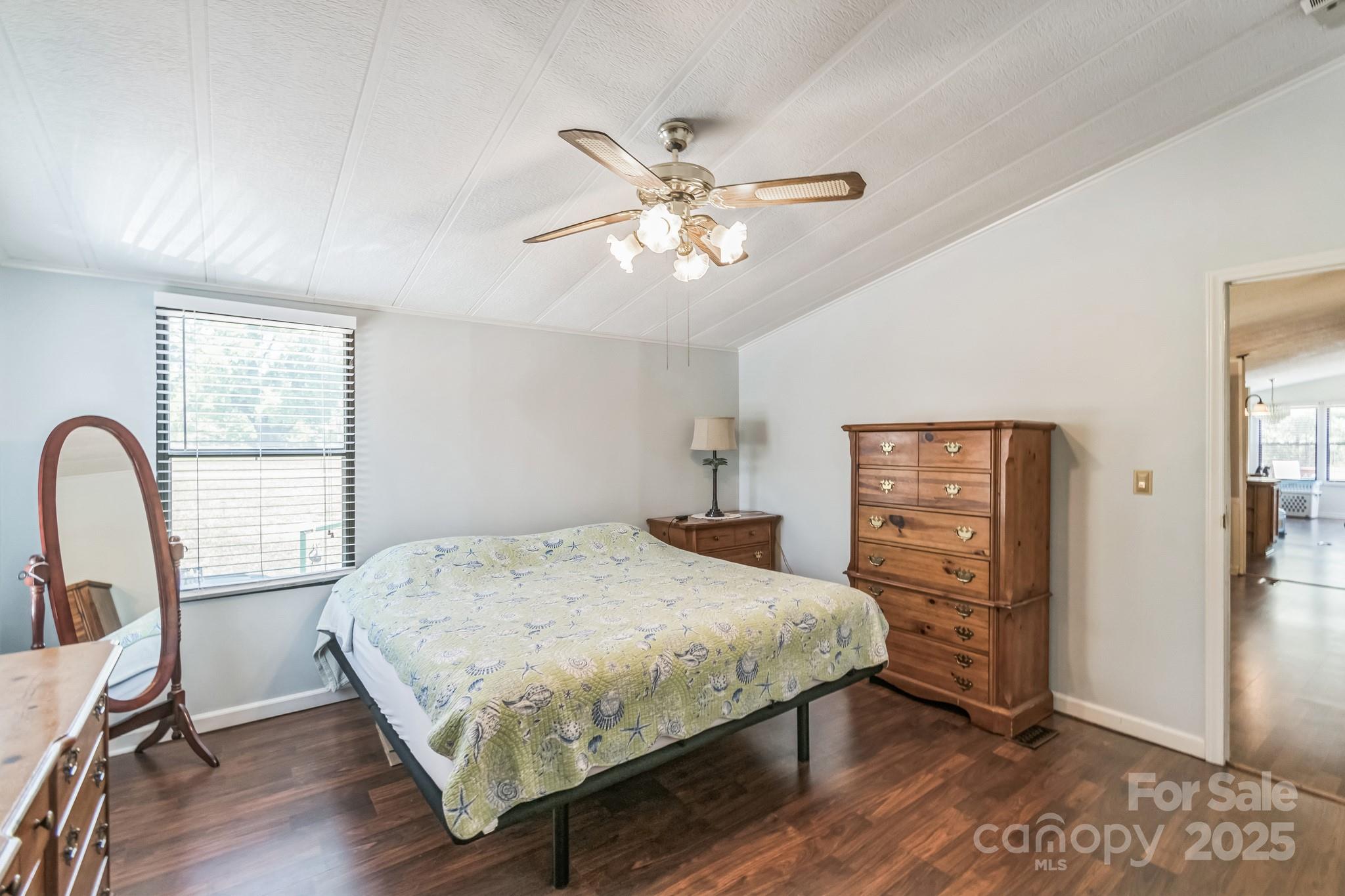 164 Phelps Road Chesterfield, SC 29709 - Photo 12 of 27 a bedroom with a bed a dresser and a large window
