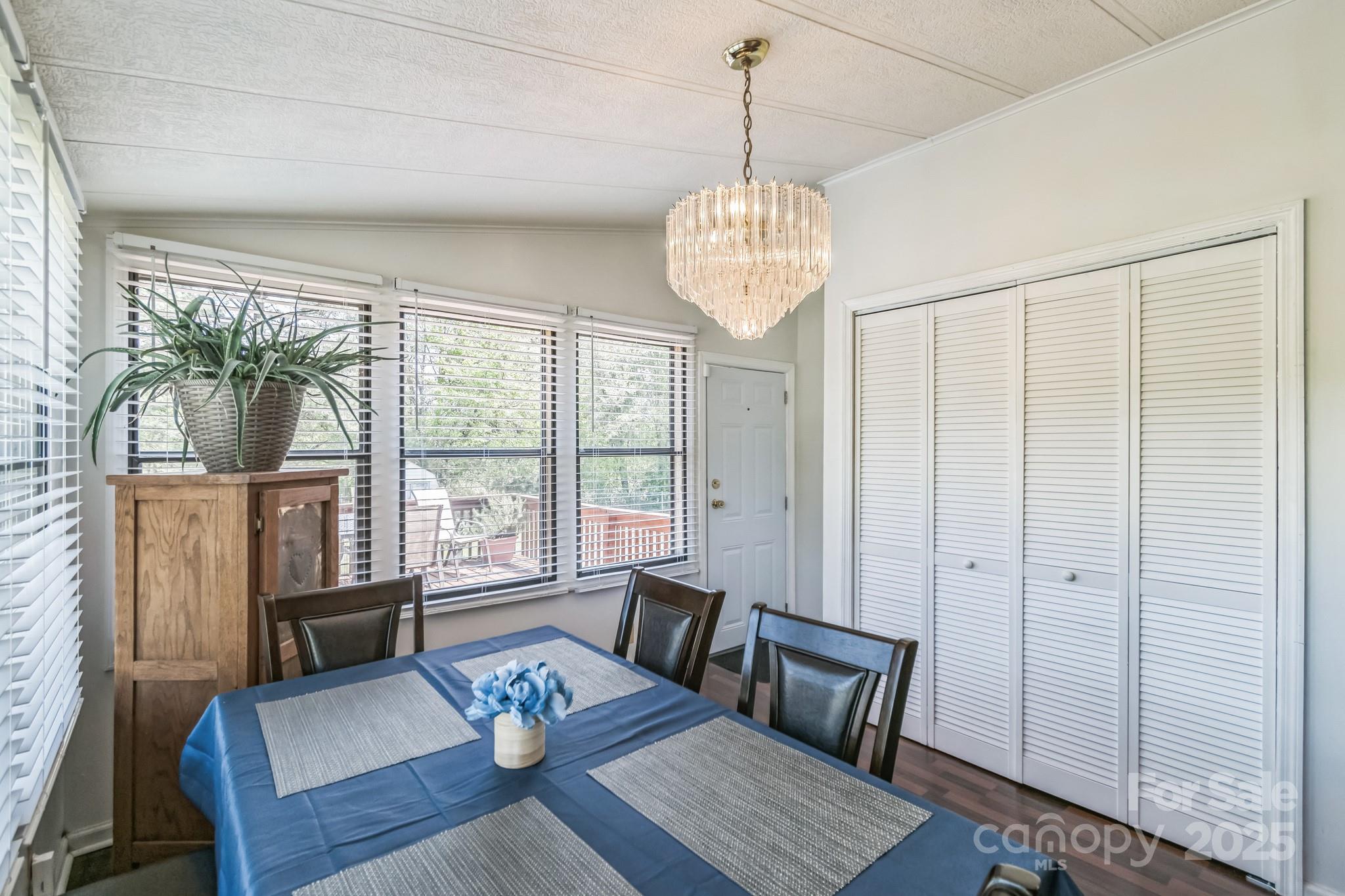 164 Phelps Road Chesterfield, SC 29709 - Photo 13 of 27 a living room with furniture and a chandelier