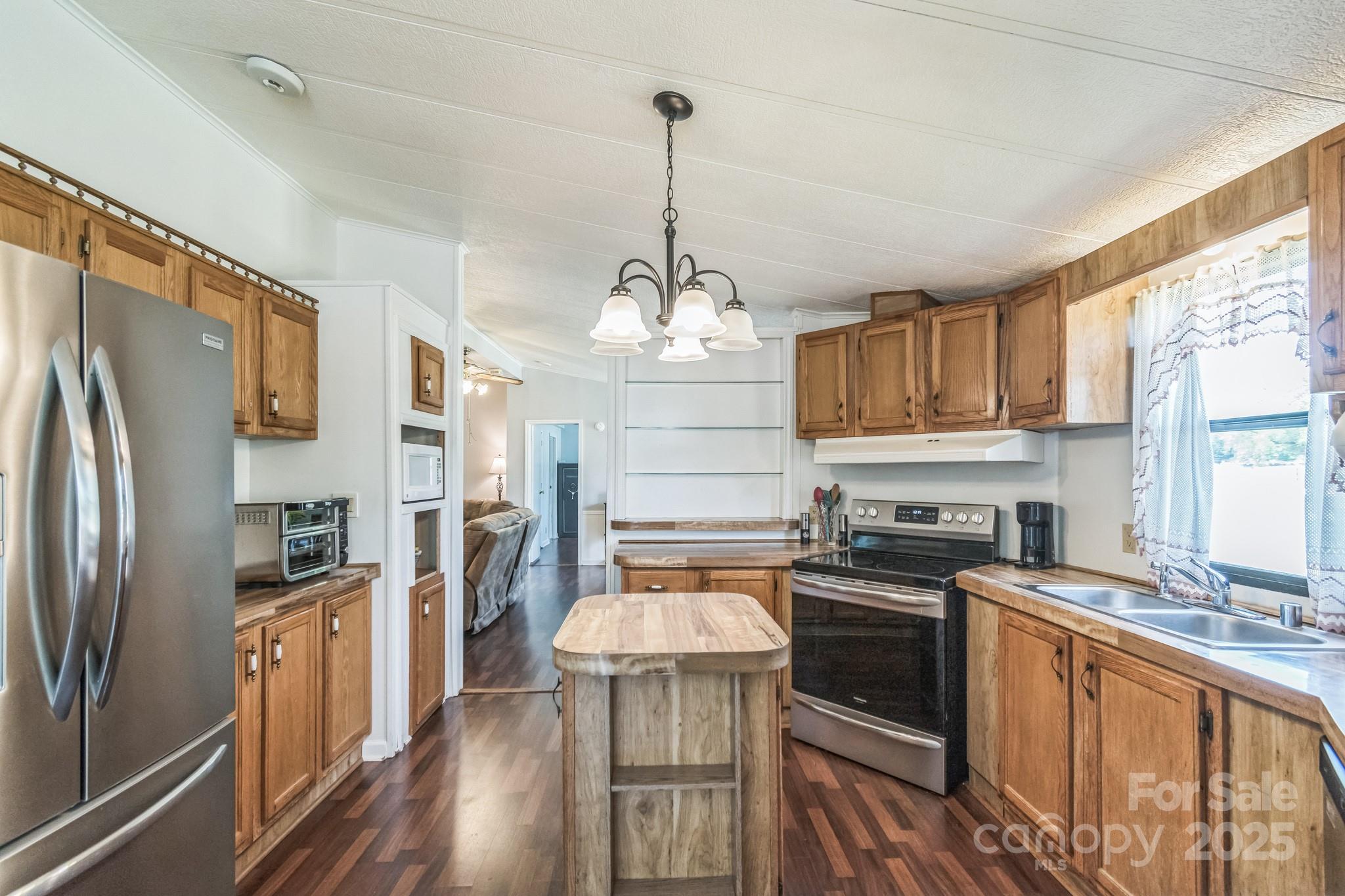 164 Phelps Road Chesterfield, SC 29709 - Photo 2 of 27 a kitchen with stainless steel appliances a stove top oven a refrigerator a sink and dishwasher