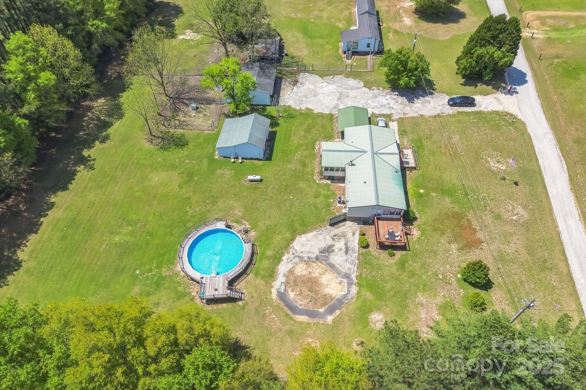 164 Phelps Road Chesterfield, SC 29709 - Photo 22 of 27 an aerial view of a house with a swimming pool and garden view