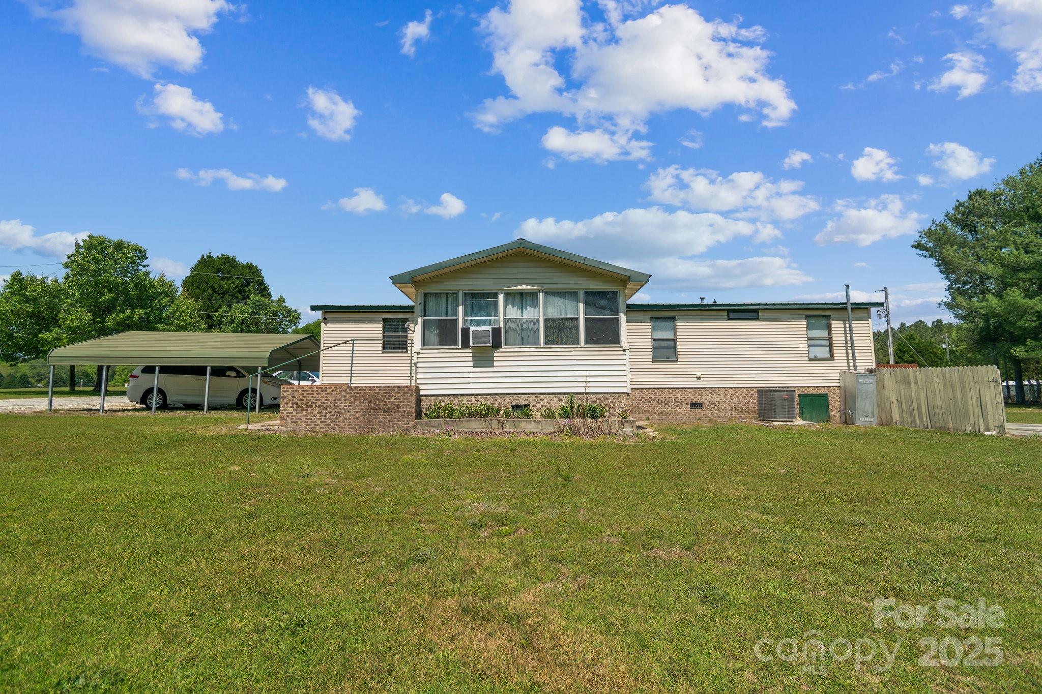 164 Phelps Road Chesterfield, SC 29709 - Photo 23 of 27 a front view of a house with a garden