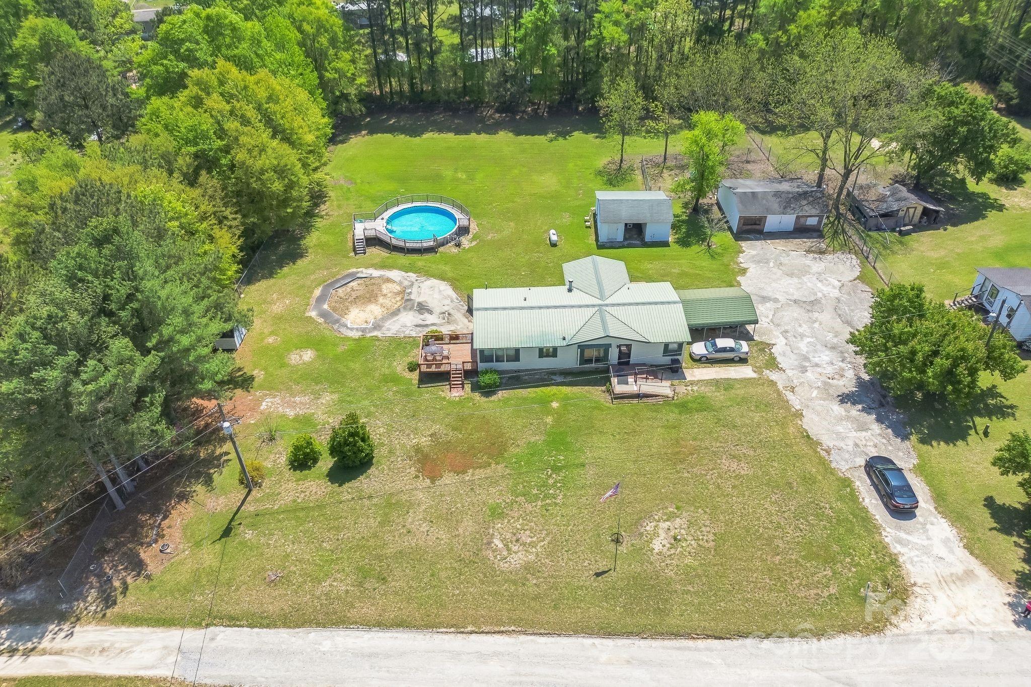 164 Phelps Road Chesterfield, SC 29709 - Photo 24 of 27 a view of a swimming pool with a yard