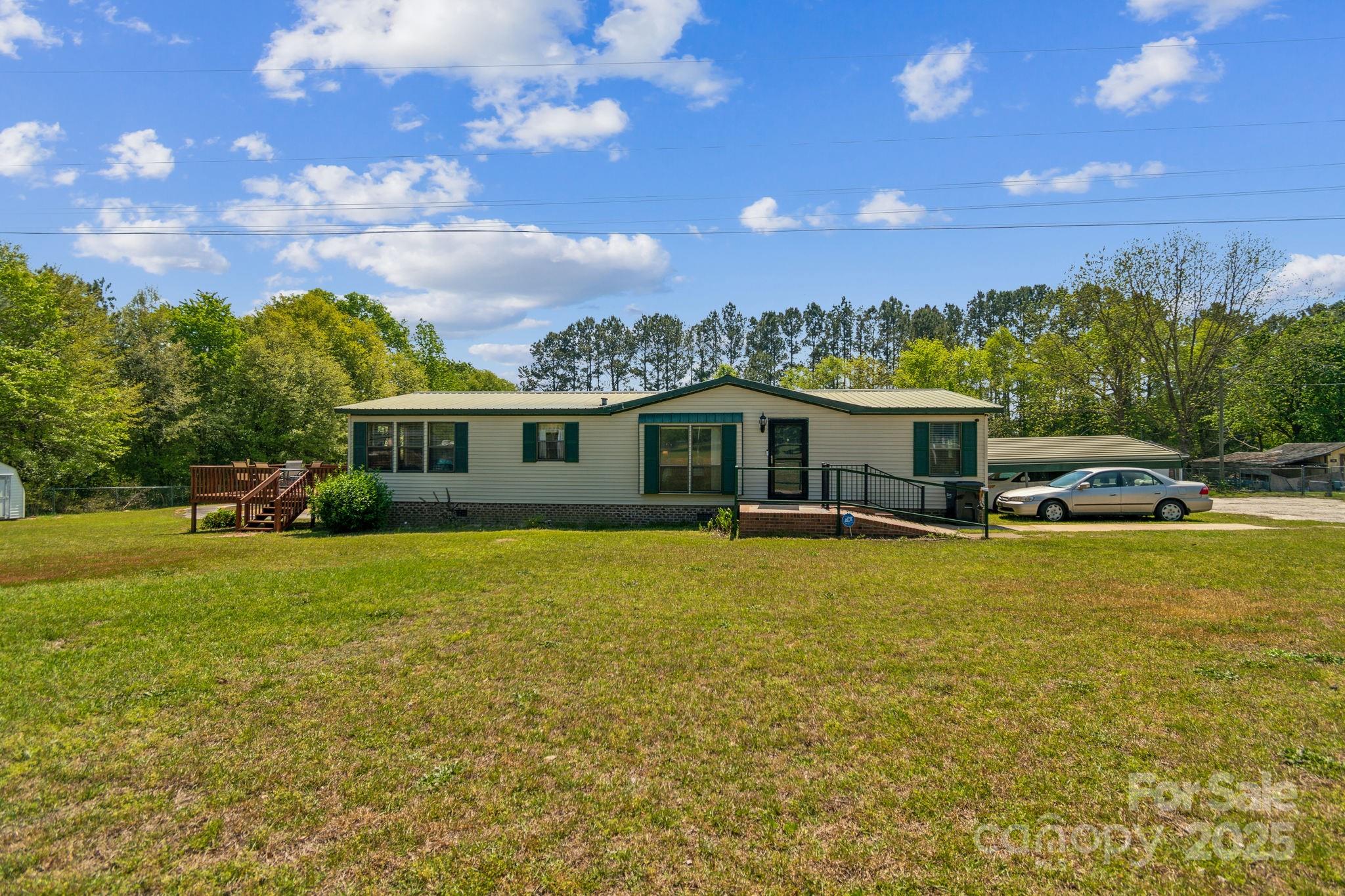 164 Phelps Road Chesterfield, SC 29709 - Photo 26 of 27 a front view of a house with a garden