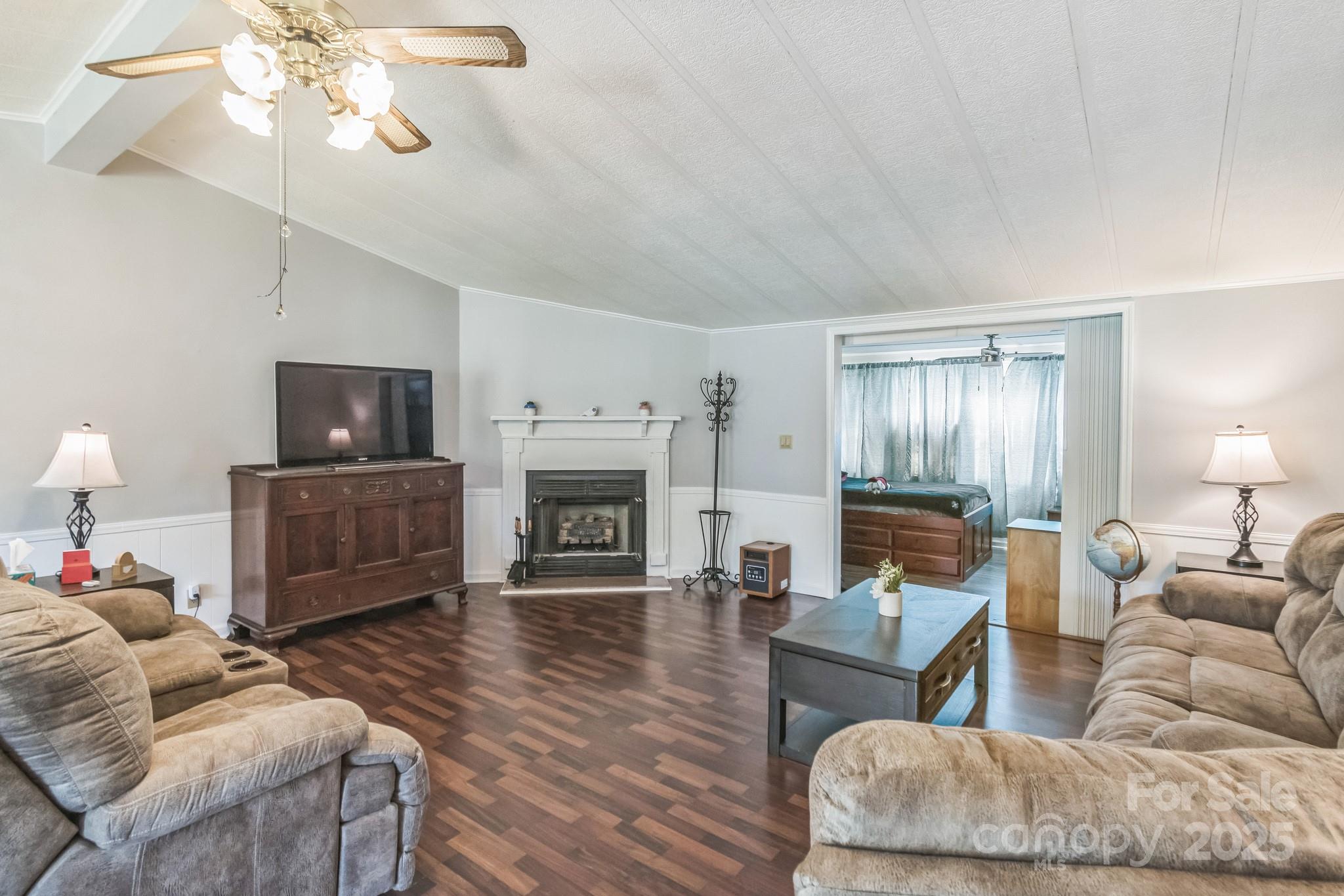 164 Phelps Road Chesterfield, SC 29709 - Photo 4 of 27 a living room with furniture and a fireplace