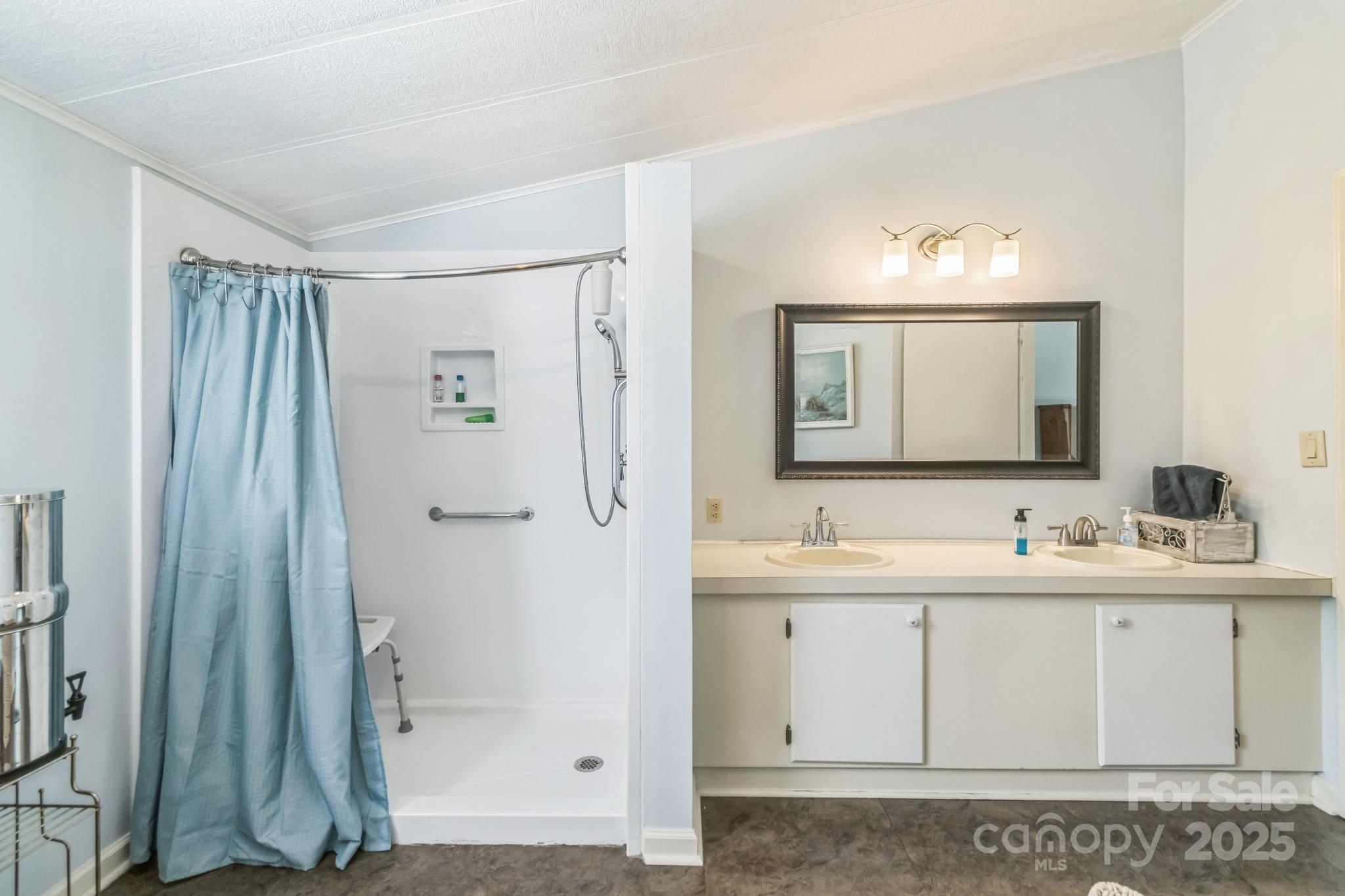 164 Phelps Road Chesterfield, SC 29709 - Photo 8 of 27 a bathroom with a double vanity sink mirror and shower