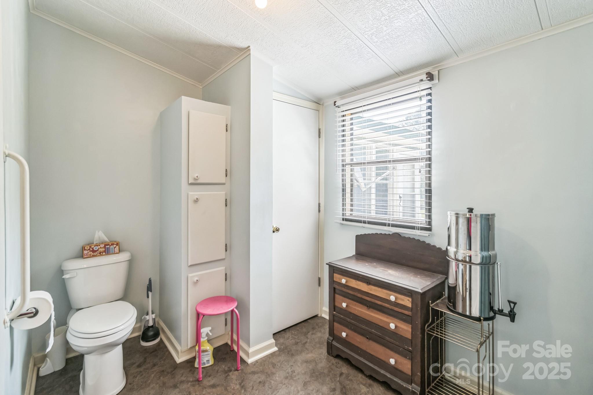 164 Phelps Road Chesterfield, SC 29709 - Photo 9 of 27 a bathroom with a sink toilet vanity and bathtub