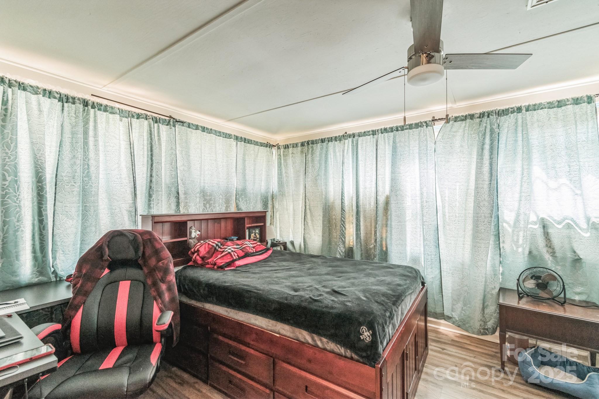 164 Phelps Road Chesterfield, SC 29709 - Photo 10 of 27 a bed room with a bed and a window