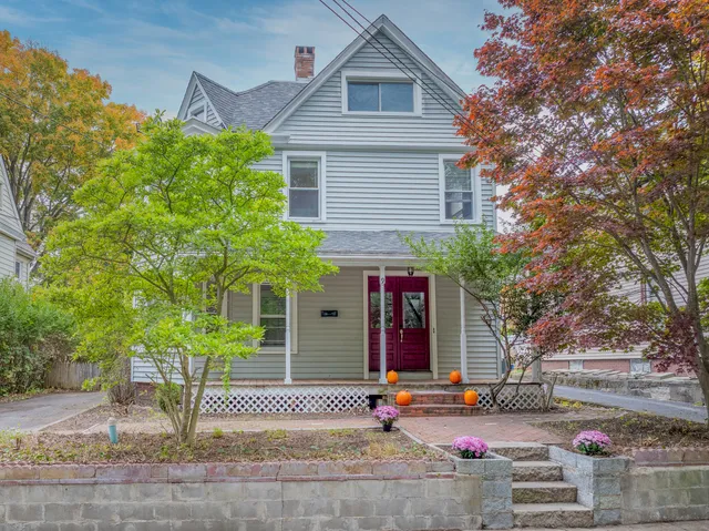 a front view of a house with garden