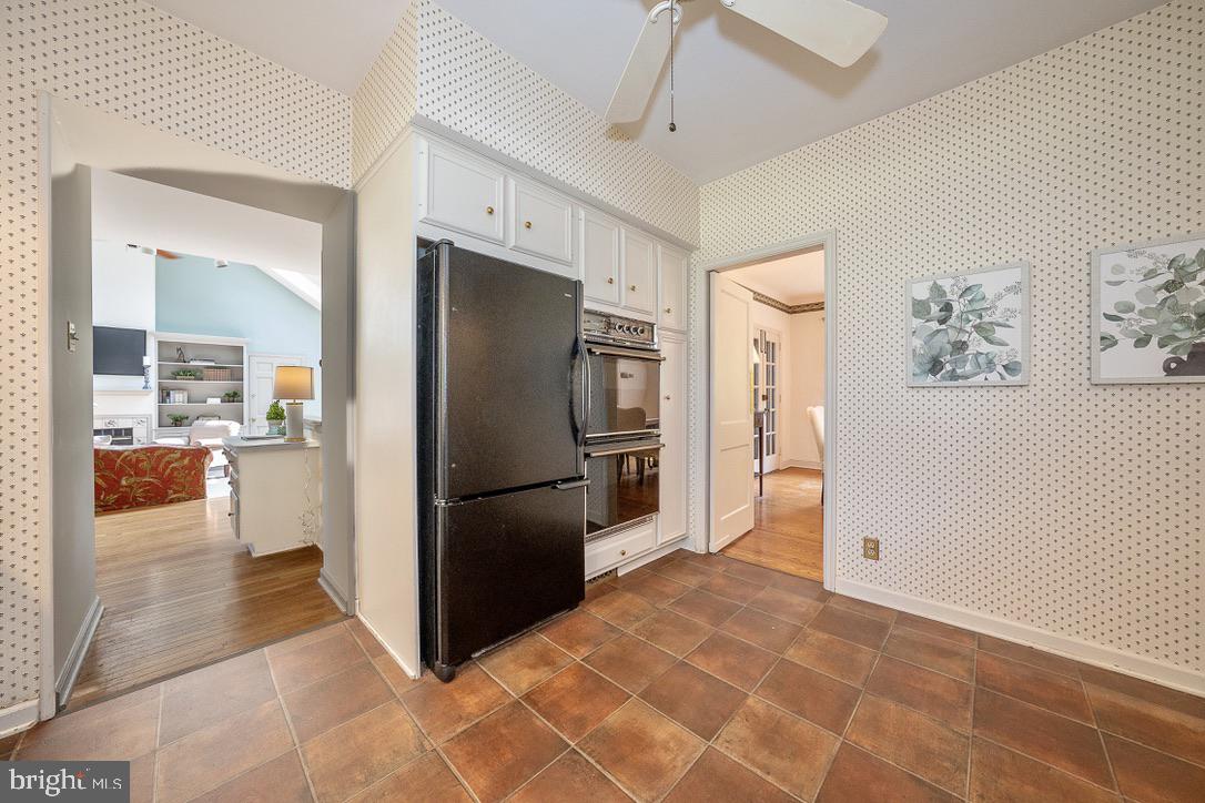 245 Ashwood Road Villanova, PA 19085 - Photo 23 of 61 a bathroom with a refrigerator and a sink
