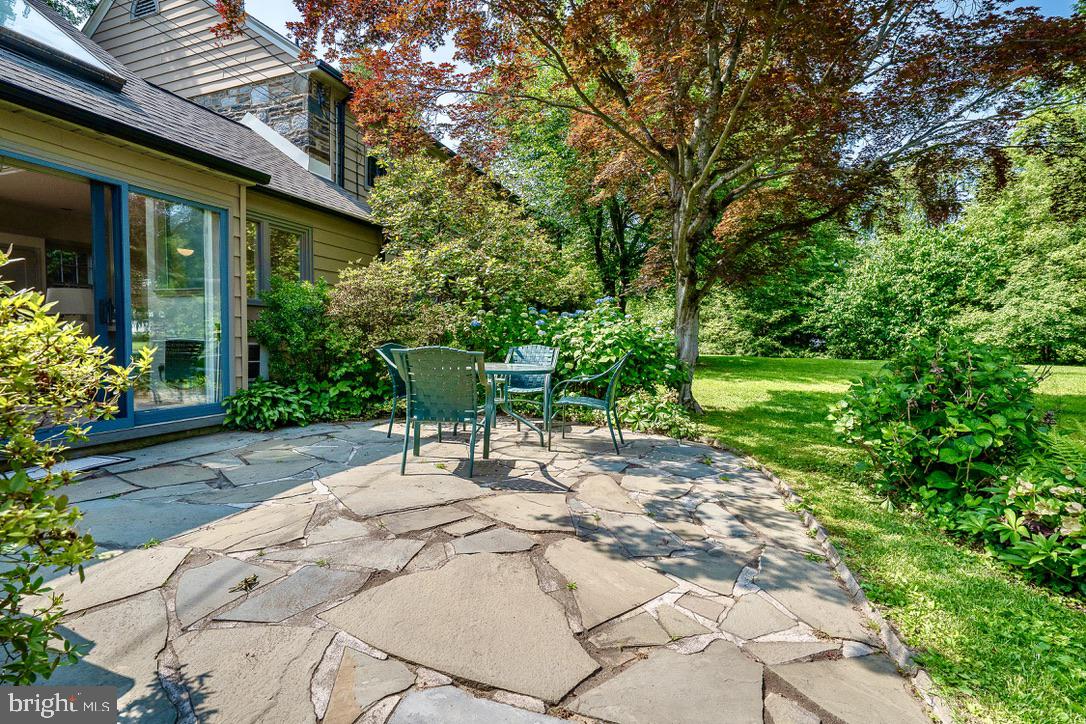 245 Ashwood Road Villanova, PA 19085 - Photo 48 of 61 a view of a chair and table in backyard of the house