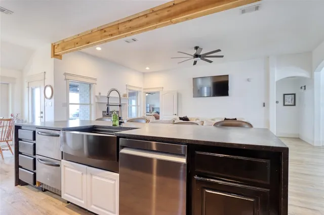 a view of a kitchen with electric appliances