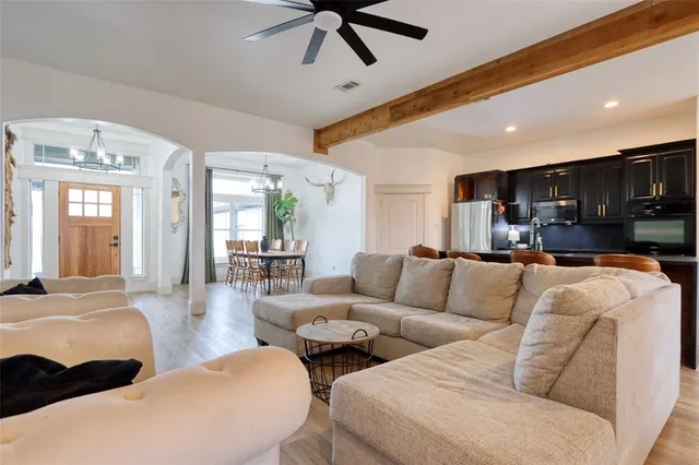 a view of a livingroom with furniture window and wooden floor