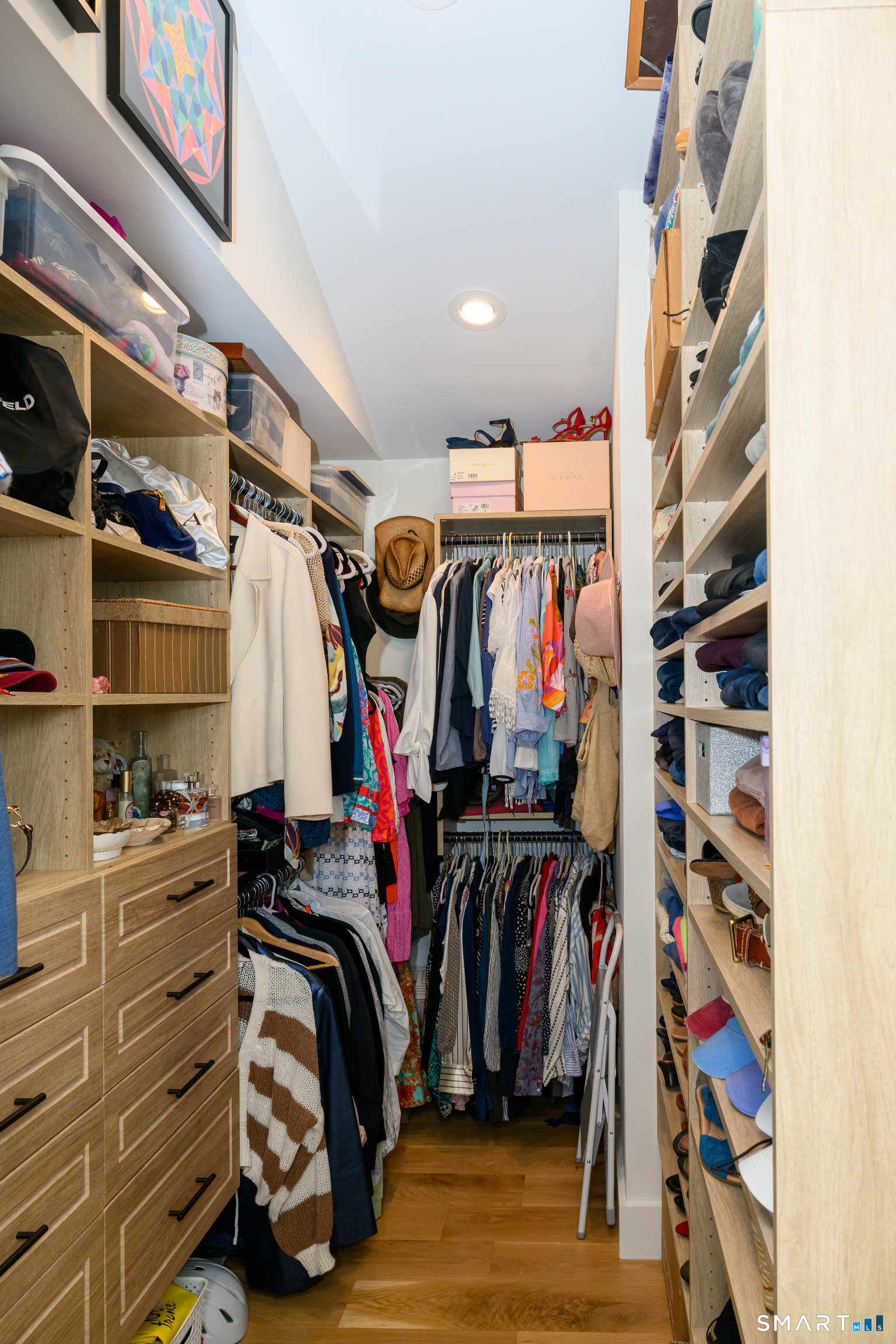 8 East Wharf Road Waterford, CT 06385 - Photo 17 of 40 a view of walk in closet with clothes