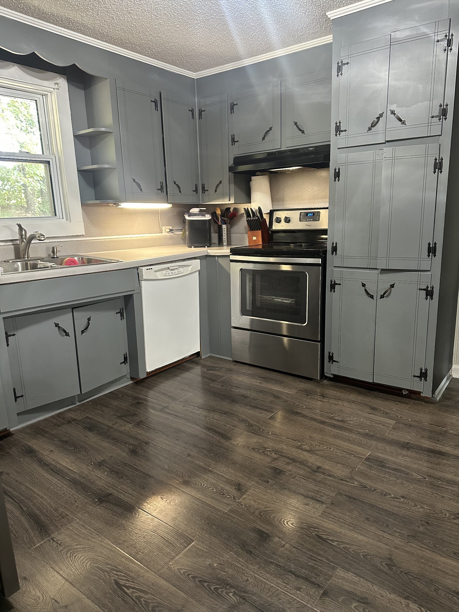 16 Cummings Road Summertown, TN 38483 - Photo 25 of 33 a kitchen with a sink stainless steel appliances and cabinets