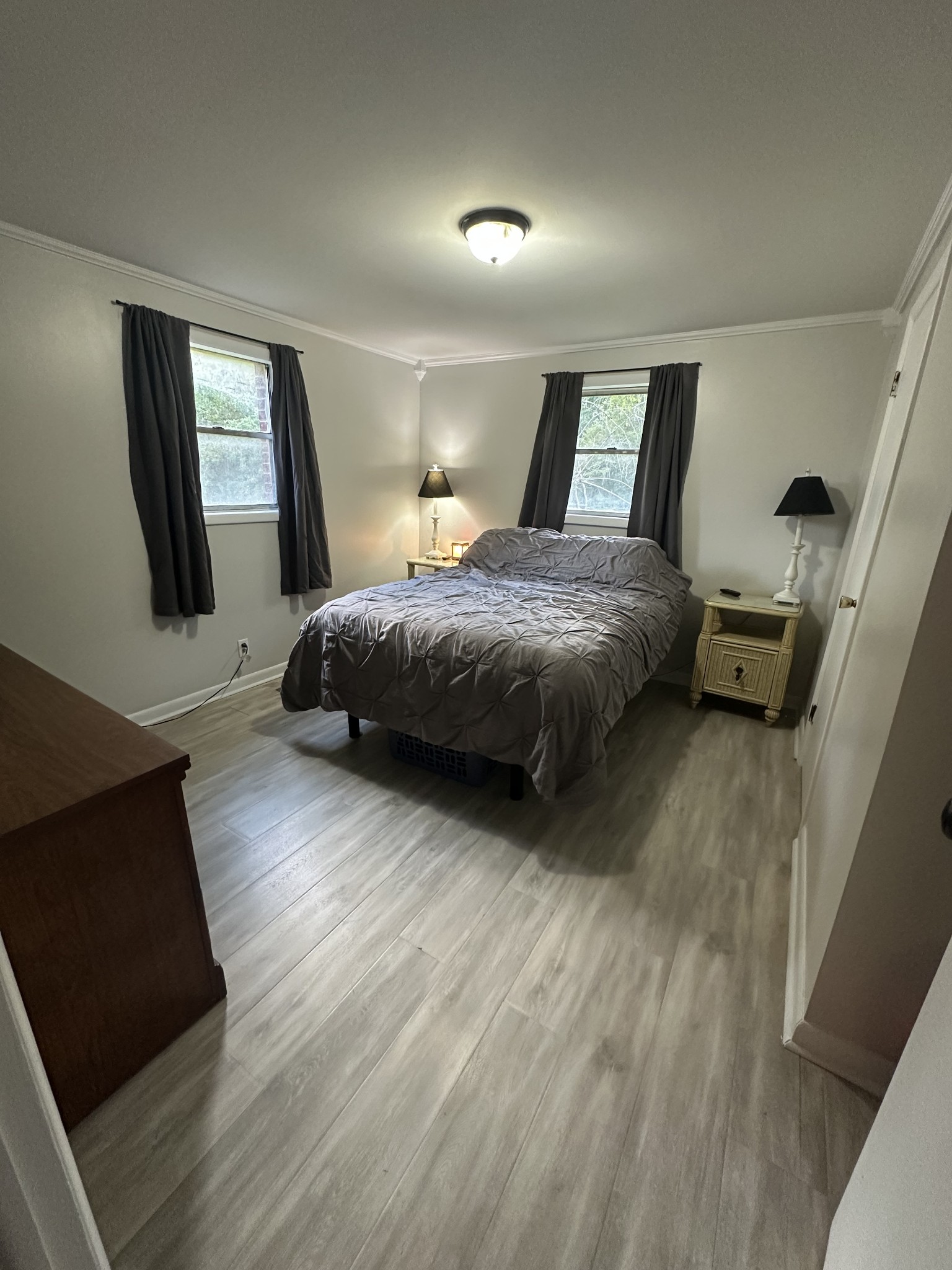 16 Cummings Road Summertown, TN 38483 - Photo 29 of 33 a spacious bedroom with a bed and wooden floor