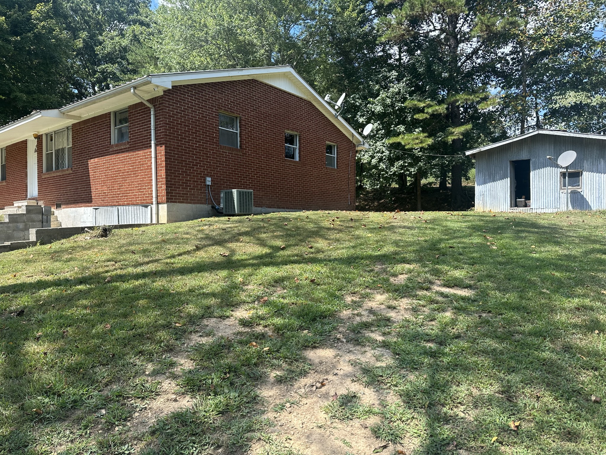 16 Cummings Road Summertown, TN 38483 - Photo 9 of 33 a backyard of a house with table and chairs