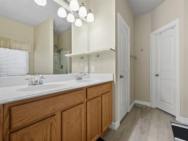 a bathroom with a sink a vanity and a mirror