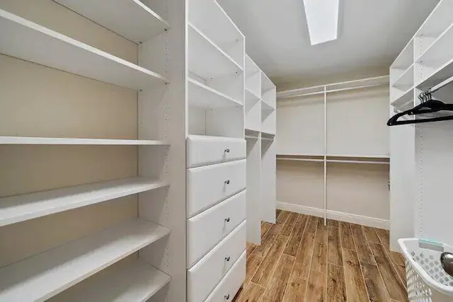 a view of an empty walk in closet