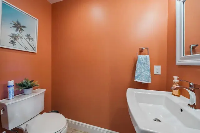 a bathroom with a toilet and a sink